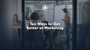 The blog title about bank and credit union marketing over an image of people deliberating in a conference room.